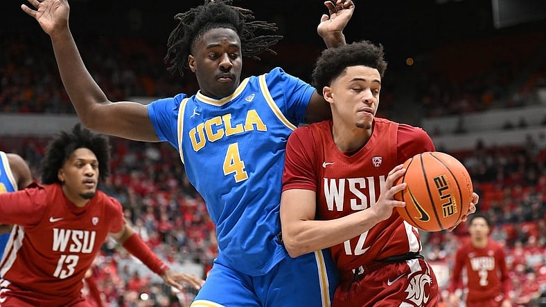 Mar 2, 2024; Pullman, Washington, USA; Washington State Cougars guard Isaiah Watts (12) controls the ball against UCLA Bruins guard Will McClendon (4) in the first half at Friel Court at Beasley Coliseum. Mandatory Credit: James Snook-USA TODAY Sports