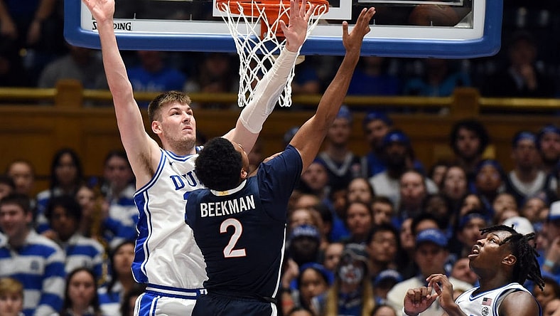 Mar 2, 2024; Durham, North Carolina, USA; Virginia Cavaliers guard Reece Beekman (2) shoots over Duke Blue Devils center Kyle Filipowski (30) during the second half at Cameron Indoor Stadium. Mandatory Credit: Rob Kinnan-USA TODAY Sports