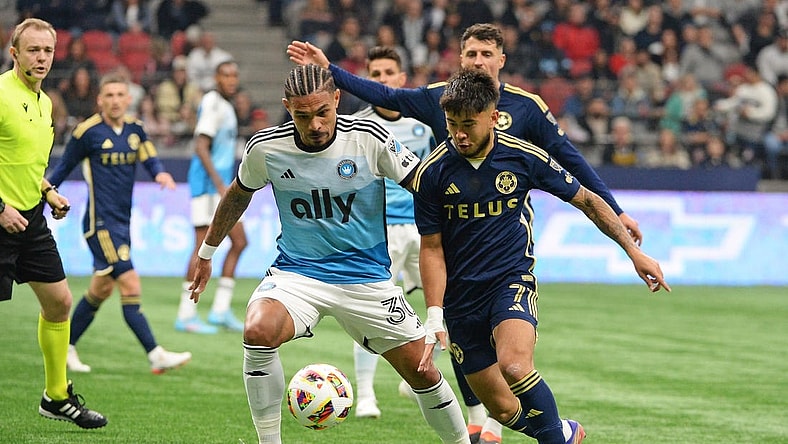 Mar 2, 2024; Vancouver, British Columbia, CAN; Charlotte FC defender Jere Uronen (3) and Vancouver Whitecaps FC midfielder Ryan Raposo (7) race after the ball during the first half at BC Place. Mandatory Credit: Anne-Marie Sorvin-USA TODAY Sports