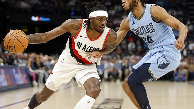 Mar 2, 2024; Memphis, Tennessee, USA; Portland Trail Blazers forward Jerami Grant (9) drives to the basket as Memphis Grizzlies forward Lamar Stevens (24) defends during the first half at FedExForum. Mandatory Credit: Petre Thomas-USA TODAY Sports