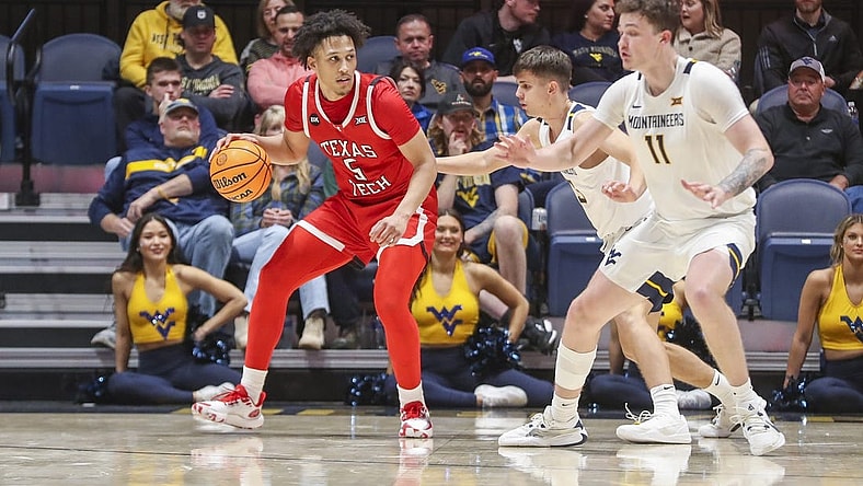 Mar 2, 2024; Morgantown, West Virginia, USA; Texas Tech Red Raiders guard Darrion Williams (5) backs down West Virginia Mountaineers guard Kerr Kriisa (3) during the second half at WVU Coliseum. Mandatory Credit: Ben Queen-USA TODAY Sports