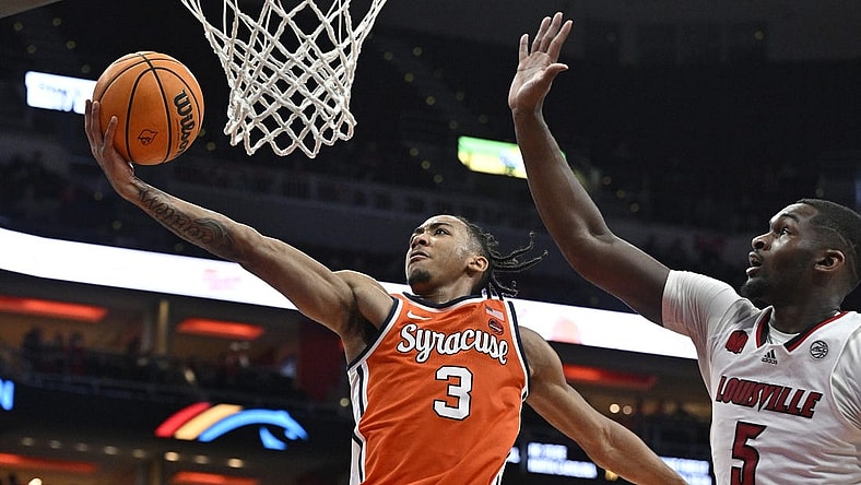 Mar 2, 2024; Louisville, Kentucky, USA; Syracuse Orange guard Judah Mintz (3) shoots against Louisville Cardinals forward Brandon Huntley-Hatfield (5) during the first half at KFC Yum! Center. Mandatory Credit: Jamie Rhodes-USA TODAY Sports
