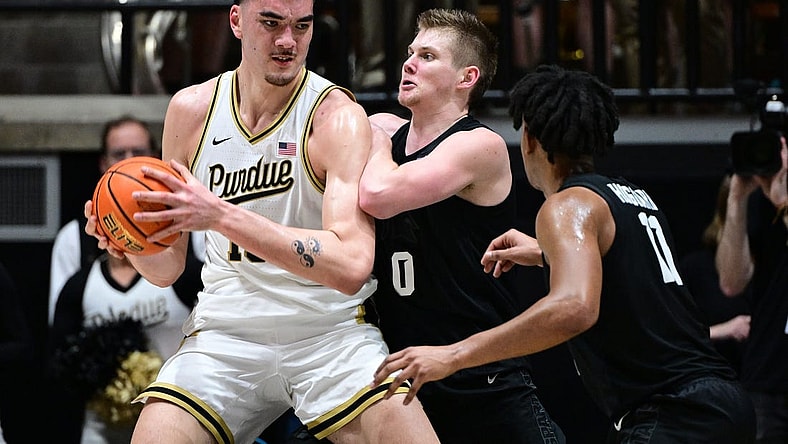 Mar 2, 2024; West Lafayette, Indiana, USA; Purdue Boilermakers center Zach Edey (15) pushes against Michigan State Spartans forward Jaxon Kohler (0) during the first half at Mackey Arena. Mandatory Credit: Marc Lebryk-USA TODAY Sports