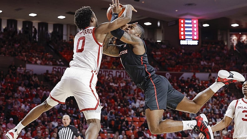 Mar 2, 2024; Norman, Oklahoma, USA; Houston Cougars guard Jamal Shead (1) and Oklahoma Sooners guard Le'Tre Darthard (0) reach for a loose ball during the first half at Lloyd Noble Center. Mandatory Credit: Alonzo Adams-USA TODAY Sports