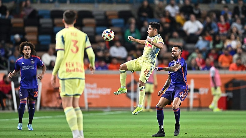 Mar 2, 2024; Houston, Texas, USA; New York Red Bulls midfielder Frankie Amaya (8) plays the ball defend by Houston Dynamo FC midfielder Artur (6) in the first half  at Shell Energy Stadium. Mandatory Credit: Maria Lysaker-USA TODAY Sports
