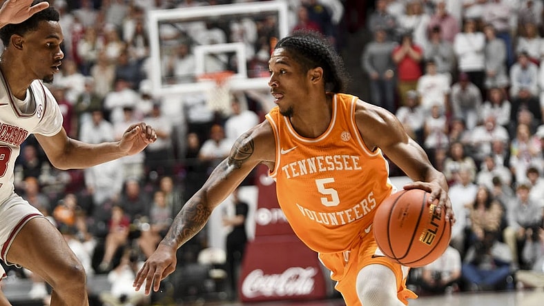 Mar 2, 2024; Tuscaloosa, Alabama, USA; Tennessee guard Zakai Zeigler (5) drives against Alabama guard Rylan Griffen (3) at Coleman Coliseum. Mandatory Credit: Gary Cosby Jr.-USA TODAY Sports