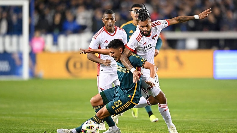 Mar 2, 2024; San Jose, California, USA; San Jose Earthquakes forward Will Richmond (20) battles for the ball against LA Galaxy midfielder Mark Delgado (8) during the first half at PayPal Park. Mandatory Credit: Robert Edwards-USA TODAY Sports