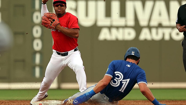 Mar 3, 2024; Fort Myers, Florida, USA; Boston Red Sox second baseman Enmanuel Valdez (47) forces out Toronto Blue Jays outfielder Cam Eden (31) and throws the ball to first base for a double play during the third inning at JetBlue Park at Fenway South. Mandatory Credit: Kim Klement Neitzel-USA TODAY Sports