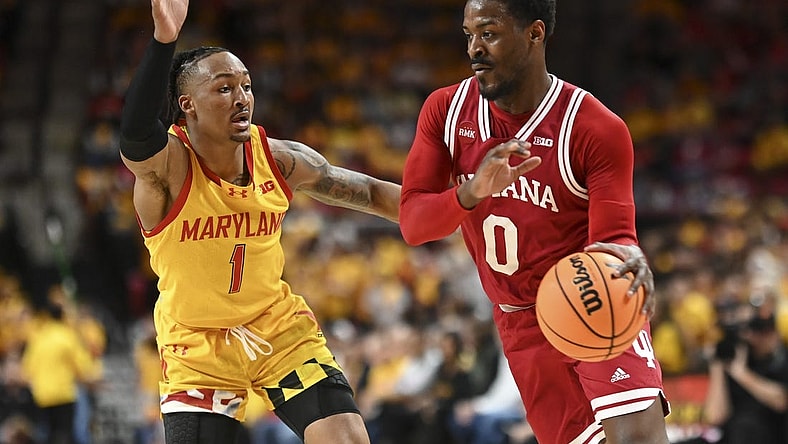 Mar 3, 2024; College Park, Maryland, USA;  Indiana Hoosiers guard Xavier Johnson (0) drives to the basket on Maryland Terrapins guard Jahmir Young (1) during the first half at Xfinity Center. Mandatory Credit: Tommy Gilligan-USA TODAY Sports
