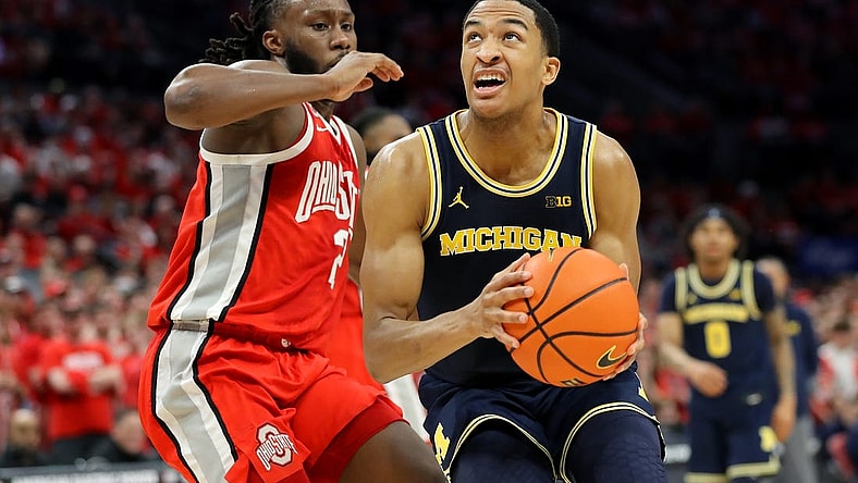 Mar 3, 2024; Columbus, Ohio, USA; Michigan Wolverines guard Nimari Burnett (4) drives to the basket as Ohio State Buckeyes guard Bruce Thornton (2) defends during the first half at Value City Arena. Mandatory Credit: Joseph Maiorana-USA TODAY Sports