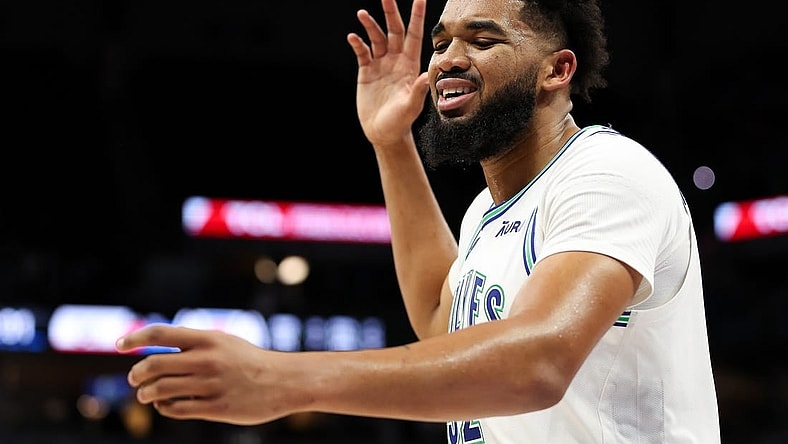 Mar 3, 2024; Minneapolis, Minnesota, USA; Minnesota Timberwolves center Karl-Anthony Towns (32) reacts after being charged with a foul against the LA Clippers during the second half at Target Center. Mandatory Credit: Matt Krohn-USA TODAY Sports