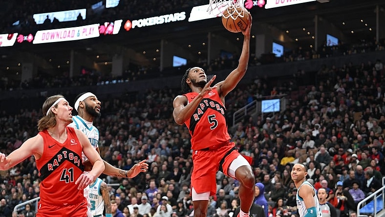 Mar 3, 2024; Toronto, Ontario, CAN;  Toronto Raptors guard Immanuel Quickley (5) scores on a layup against the Charlotte Hornets in the first half at Scotiabank Arena. Mandatory Credit: Dan Hamilton-USA TODAY Sports