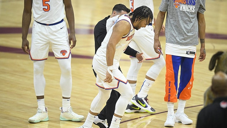 Mar 3, 2024; Cleveland, Ohio, USA; New York Knicks guard Jalen Brunson (11) limps off the court in the first quarter against the Cleveland Cavaliers at Rocket Mortgage FieldHouse. Mandatory Credit: David Richard-USA TODAY Sports