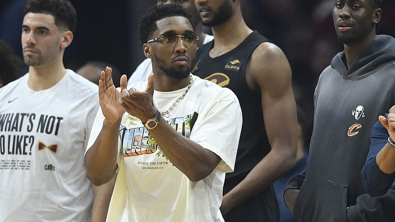 Mar 3, 2024; Cleveland, Ohio, USA; Cleveland Cavaliers guard Donovan Mitchell (front) reacts in the second quarter against the New York Knicks at Rocket Mortgage FieldHouse. Mandatory Credit: David Richard-USA TODAY Sports