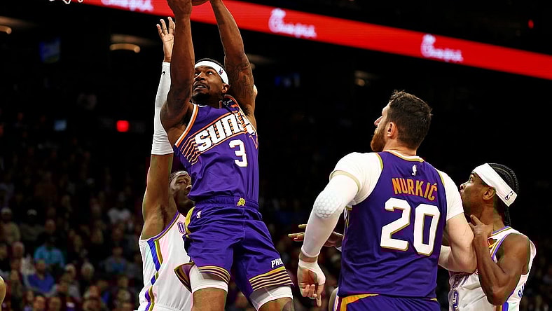 Mar 3, 2024; Phoenix, Arizona, USA; Phoenix Suns guard Bradley Beal (3) shoots the ball against Oklahoma City Thunder guard Shai Gilgeous-Alexander (2) at Footprint Center. Mandatory Credit: Mark J. Rebilas-USA TODAY Sports
