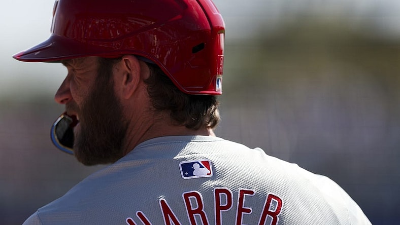 Mar 4, 2024; Dunedin, Florida, USA;  Philadelphia Phillies first baseman Bryce Harper (3) looks on from the on deck circle during a game against the Toronto Blue Jays in the third inning at TD Ballpark. Mandatory Credit: Nathan Ray Seebeck-USA TODAY Sports
