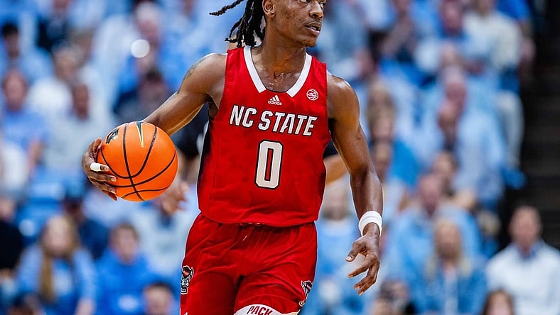 Mar 2, 2024; Chapel Hill, North Carolina, USA; North Carolina State Wolfpack guard DJ Horne (0) brings the ball up court against the North Carolina Tar Heels at Dean E. Smith Center. Mandatory Credit: Scott Kinser-USA TODAY Sports