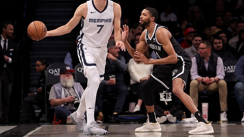 Mar 4, 2024; Brooklyn, New York, USA; Memphis Grizzlies forward Santi Aldama (7) controls the ball against Brooklyn Nets forward Mikal Bridges (1) during the first quarter at Barclays Center. Mandatory Credit: Brad Penner-USA TODAY Sports
