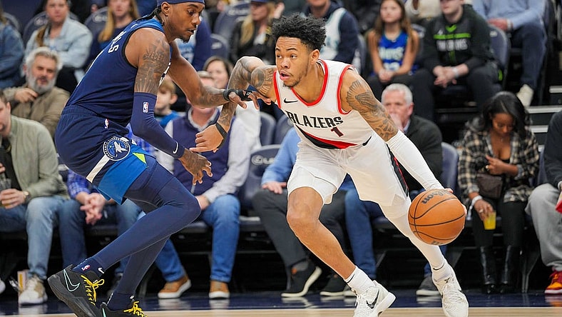 Mar 4, 2024; Minneapolis, Minnesota, USA; Portland Trail Blazers guard Anfernee Simons (1) dribbles against the Minnesota Timberwolves forward Jaden McDaniels (3) in the first quarter at Target Center. Mandatory Credit: Brad Rempel-USA TODAY Sports