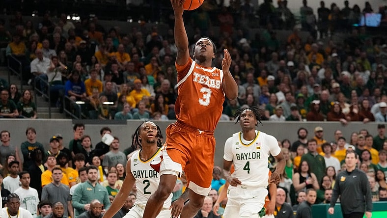 Mar 4, 2024; Waco, Texas, USA;  Texas Longhorns guard Max Abmas (3) scores a layup past Baylor Bears guard Jayden Nunn (2) during the first half at Paul and Alejandra Foster Pavilion. Mandatory Credit: Chris Jones-USA TODAY Sports