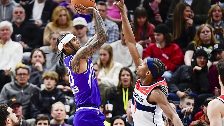 Mar 4, 2024; Salt Lake City, Utah, USA; Utah Jazz guard Jordan Clarkson (00) shoots over Washington Wizards guard Bilal Coulibaly (0) during the first half at the Delta Center. Mandatory Credit: Christopher Creveling-USA TODAY Sports