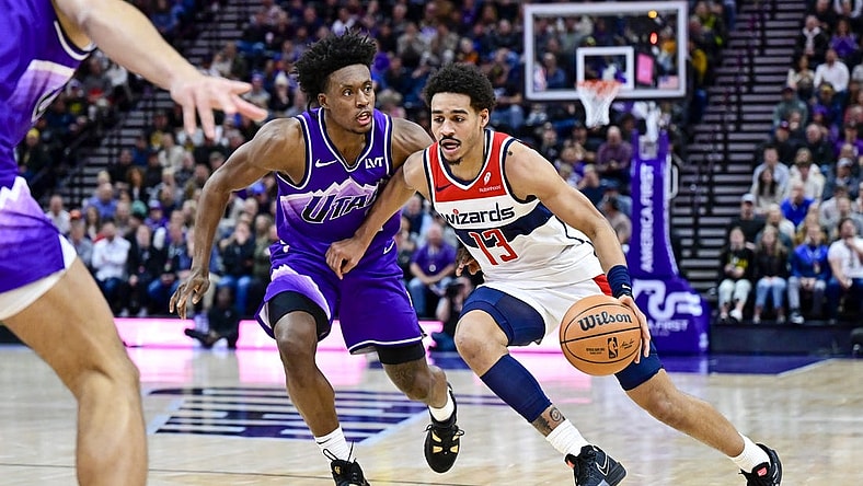 Mar 4, 2024; Salt Lake City, Utah, USA; Washington Wizards guard Jordan Poole (13) drives around Utah Jazz guard Collin Sexton (2) during the first half at the Delta Center. Mandatory Credit: Christopher Creveling-USA TODAY Sports