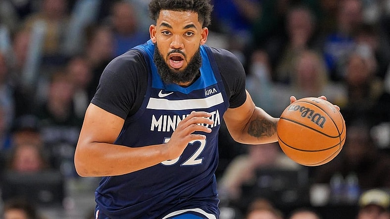 Mar 4, 2024; Minneapolis, Minnesota, USA; Minnesota Timberwolves center Karl-Anthony Towns (32) dribbles against the Portland Trail Blazers in the third quarter at Target Center. Mandatory Credit: Brad Rempel-USA TODAY Sports