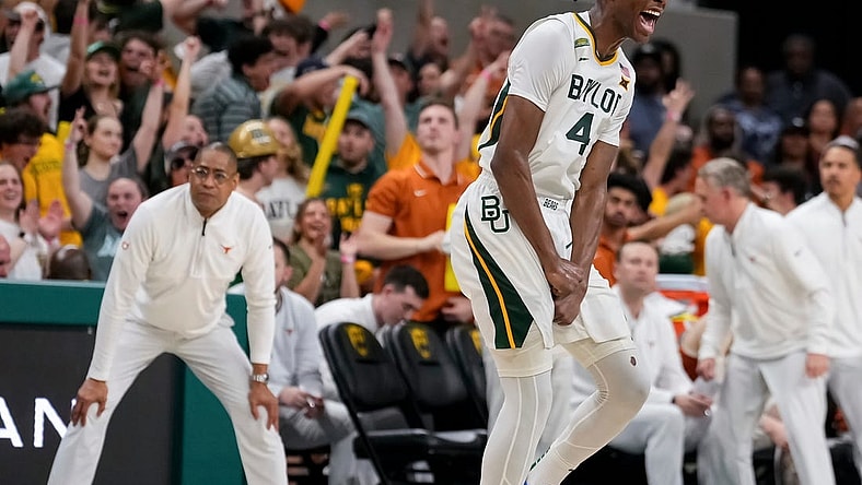 Mar 4, 2024; Waco, Texas, USA; Baylor Bears guard Ja'Kobe Walter (4) reacts after scoring a three point basket against the Texas Longhorns during the second half at Paul and Alejandra Foster Pavilion. Mandatory Credit: Chris Jones-USA TODAY Sports
