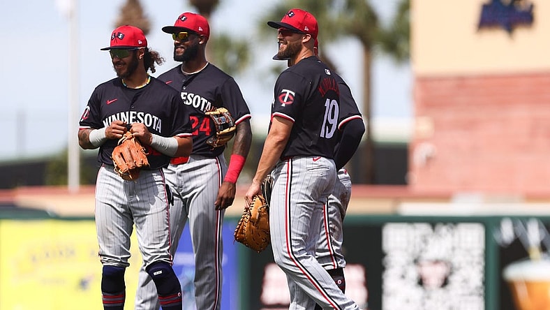 Mar 5, 2024; Jupiter, Florida, USA; Minnesota Twins second baseman Austin Martin (82), third baseman Niko Goodrum (24) and first baseman Alex Kirilloff (19) look on against the St. Louis Cardinals during the third inning at Roger Dean Chevrolet Stadium. Mandatory Credit: Sam Navarro-USA TODAY Sports