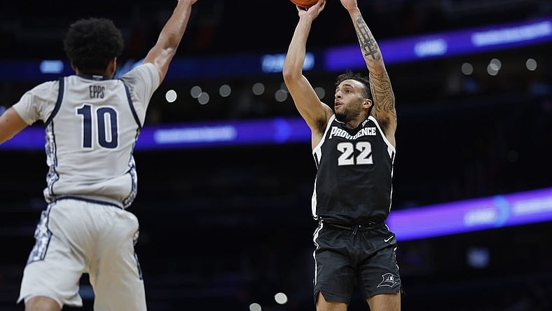 Mar 5, 2024; Washington, District of Columbia, USA;Providence Friars guard Devin Carter (22) shoots the ball as Georgetown Hoyas guard Jayden Epps (10) defends in the first half  at Capital One Arena. Mandatory Credit: Geoff Burke-USA TODAY Sports