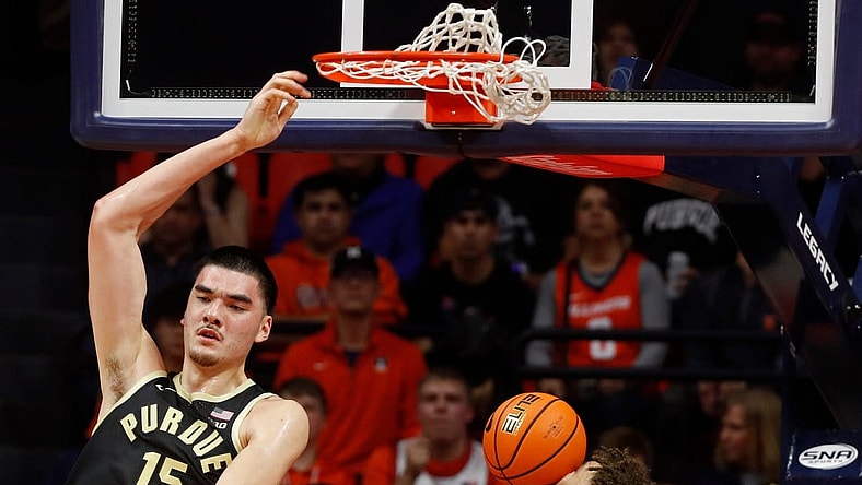 Purdue Boilermakers center Zach Edey (15) dunks the ball over Illinois Fighting Illini guard Niccolo Moretti (11), Illinois Fighting Illini forward Coleman Hawkins (33) and Illinois Fighting Illini guard Luke Goode (10) during the NCAA men   s basketball game, Tuesday, March 5, 2024, at State Farm Center in Champaign, Ill.