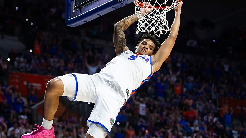 Florida Gators guard Will Richard (5) dunks the ball during the first half. The Florida men   s basketball team hosted the Alabama Crimson Tied at Exactech Arena at the Stephen C. O   Connell Center in Gainesville, FL on Tuesday, March 5, 2024. [Doug Engle/Ocala Star Banner]