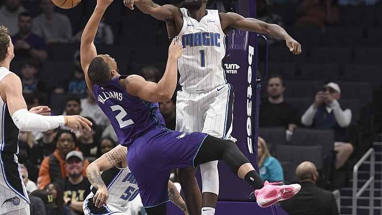 Mar 5, 2024; Charlotte, North Carolina, USA;  Orlando Magic forward Jonathan Isaac (1) defends against Charlotte Hornets forward Grant Williams (2) during the first half at the Spectrum Center. Mandatory Credit: Sam Sharpe-USA TODAY Sports