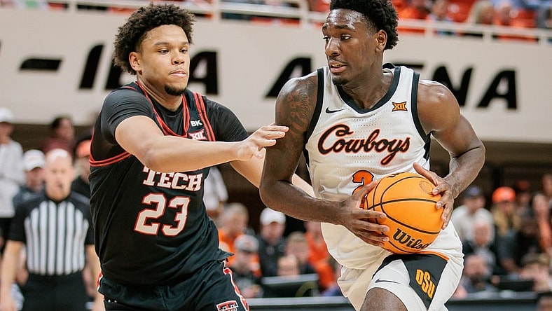 Mar 5, 2024; Stillwater, Oklahoma, USA; Oklahoma State Cowboys forward Eric Dailey Jr. (2) drives around Texas Tech Red Raiders forward Eemeli Yalaho (23) during the first half at Gallagher-Iba Arena. Mandatory Credit: William Purnell-USA TODAY Sports