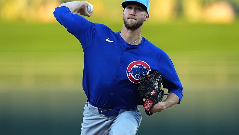 Mar 5, 2024; Surprise, Arizona, USA; Chicago Cubs starting pitcher Caleb Kilian (45) pitches against the Kansas City Royals during the first inning at Surprise Stadium. Mandatory Credit: Joe Camporeale-USA TODAY Sports