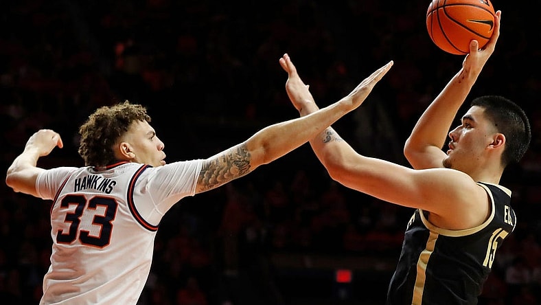 Illinois Fighting Illini forward Coleman Hawkins (33) defends the shot of Purdue Boilermakers center Zach Edey (15) during the NCAA men's basketball game, Tuesday, March 5, 2024, at State Farm Center in Champaign, Ill. Purdue Boilermakers won 77-71.