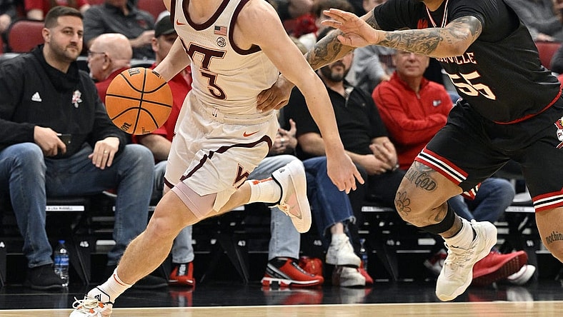 Mar 5, 2024; Louisville, Kentucky, USA; Virginia Tech Hokies guard Sean Pedulla (3) dribbles against Louisville Cardinals guard Skyy Clark (55) during the first half at KFC Yum! Center. Virginia Tech defeated Louisville 80-64. Mandatory Credit: Jamie Rhodes-USA TODAY Sports