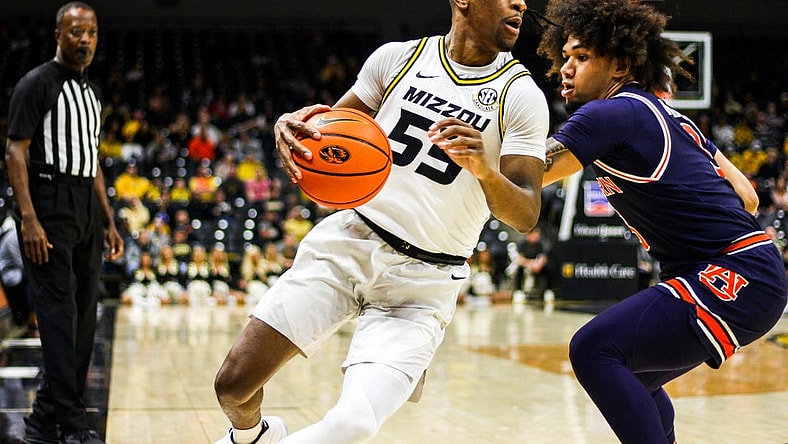 Mizzou men's basketball guard Sean East II attempts to get past an Auburn defender Tuesday at Mizzou Arena in Columbia