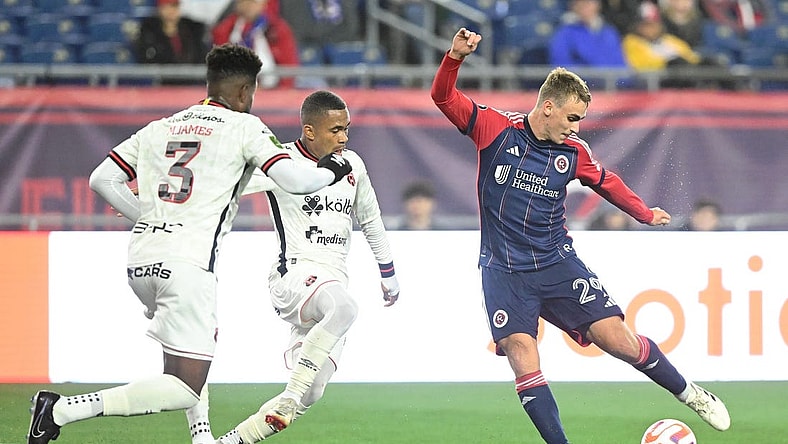 Mar 6, 2024; Foxborough, MA, USA; New England Revolution midfielder Noel Buck (29) takes a shot against Liga Deportiva Alajuelense during the second half of a match at Gillette Stadium. Mandatory Credit: Brian Fluharty-USA TODAY Sports