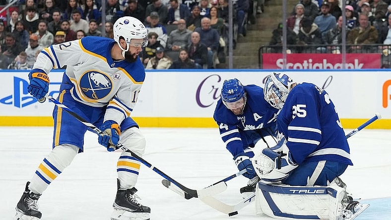 Mar 6, 2024; Toronto, Ontario, CAN; Toronto Maple Leafs defenseman Morgan Rielly (44) battles for the puck with Buffalo Sabres left wing Jordan Greenway (12) in front of goaltender Ilya Samsonov (35) during the second period at Scotiabank Arena. Mandatory Credit: Nick Turchiaro-USA TODAY Sports
