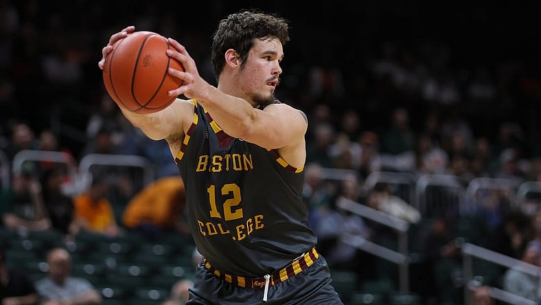 Mar 6, 2024; Coral Gables, Florida, USA; Boston College Eagles forward Quinten Post (12) controls the basketball against the Miami Hurricanes during the second half at Watsco Center. Mandatory Credit: Sam Navarro-USA TODAY Sports