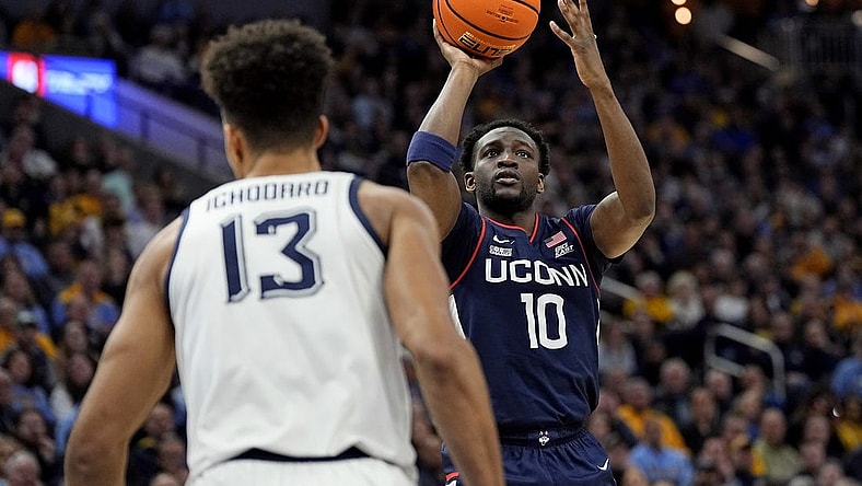 Mar 6, 2024; Milwaukee, Wisconsin, USA;  Connecticut Huskies guard Hassan Diarra (10) shoots during the first half against the Marquette Golden Eagles at Fiserv Forum. Mandatory Credit: Jeff Hanisch-USA TODAY Sports