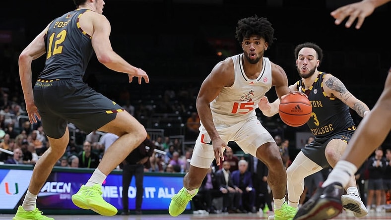 Mar 6, 2024; Coral Gables, Florida, USA; Miami Hurricanes forward Norchad Omier (15) drives to the basket past Boston College Eagles guard Jaeden Zackery (3) during the second half at Watsco Center. Mandatory Credit: Sam Navarro-USA TODAY Sports