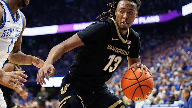 Mar 6, 2024; Lexington, Kentucky, USA; Vanderbilt Commodores guard Malik Presley (13) drives to the basket during the first half against the Kentucky Wildcats at Rupp Arena at Central Bank Center. Mandatory Credit: Jordan Prather-USA TODAY Sports