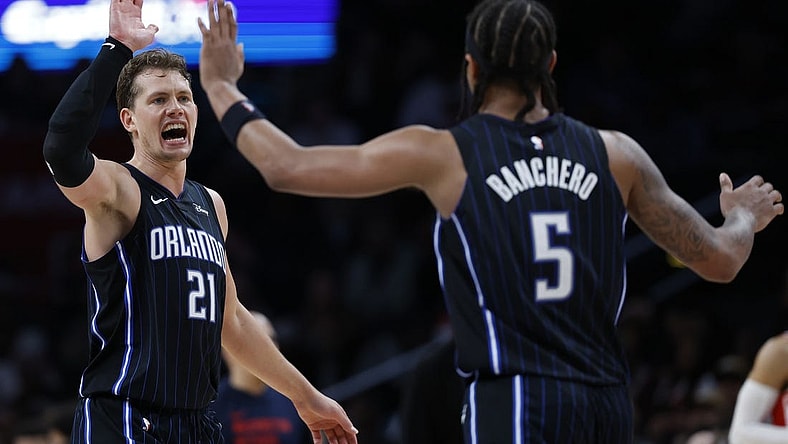 Mar 6, 2024; Washington, District of Columbia, USA; Orlando Magic center Moritz Wagner (21) celebrates with Orlando Magic forward Paolo Banchero (5) /against the Washington Wizards in the second half at Capital One Arena. Mandatory Credit: Geoff Burke-USA TODAY Sports