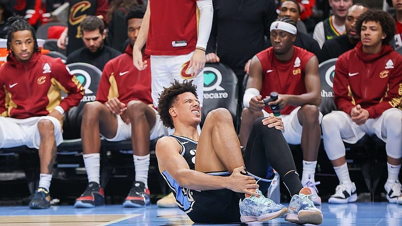 Mar 6, 2024; Atlanta, Georgia, USA; Atlanta Hawks forward Jalen Johnson (1) reacts after an ankle injury against the Cleveland Cavaliers in the second half at State Farm Arena. Mandatory Credit: Brett Davis-USA TODAY Sports