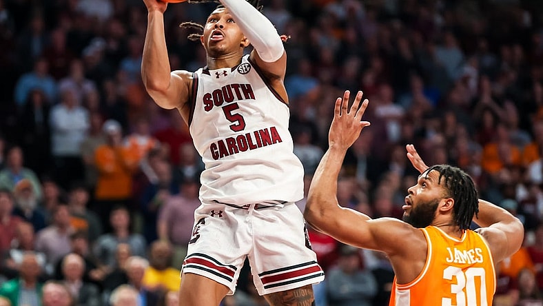 Mar 6, 2024; Columbia, South Carolina, USA; South Carolina Gamecocks guard Meechie Johnson (5) drives past Tennessee Volunteers guard Josiah-Jordan James (30) in the second half at Colonial Life Arena. Mandatory Credit: Jeff Blake-USA TODAY Sports