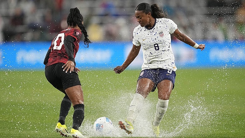 Mar 6, 2024; San Diego, California, USA;  USA forward Jaedyn Shaw (8) dribbles the ball against Canada defender Ashley Lawrence (10) during the first half of the 2024 Concacaf W Gold Cup semifinal match at Snapdragon Stadium. Mandatory Credit: Ray Acevedo-USA TODAY Sports