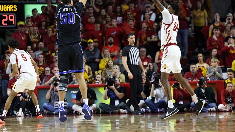 Mar 6, 2024; Ames, Iowa, USA;  Brigham Young Cougars center Aly Khalifa (50) shoots over Iowa State Cyclones forward Hason Ward (24) at James H. Hilton Coliseum. Mandatory Credit: Reese Strickland-USA TODAY Sports