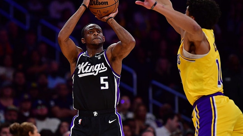 Mar 6, 2024; Los Angeles, California, USA; Sacramento Kings guard De'Aaron Fox (5) shoots against Los Angeles Lakers guard Max Christie (10) during the first half at Crypto.com Arena. Mandatory Credit: Gary A. Vasquez-USA TODAY Sports